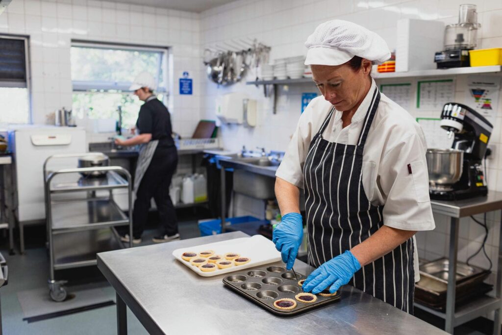 Joanne making jam tarts in the kitchen
