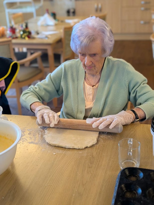 Lady cooking with a rolling pin